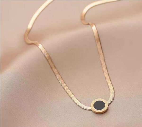 Elegant Dual-Layer Gold Snake Chain Necklace with Black Circular Pendant - Image 2