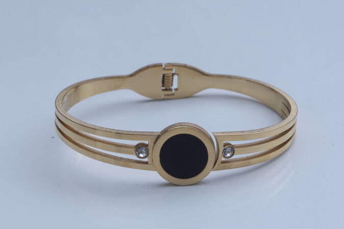 Gold-Tone Triple Band Bangle with Black Disc and Crystal Accents