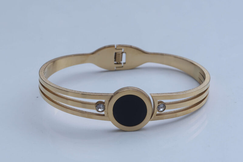 Gold-Tone Triple Band Bangle with Black Disc and Crystal Accents
