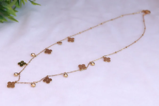 Gold Tone Chain Necklace with Floral and Disc Charms