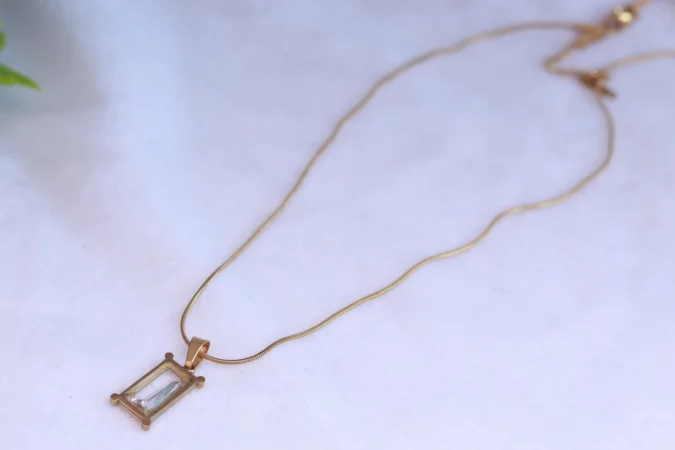 Gold Tone Snake Chain Necklace with Rectangular Clear Stone Pendant