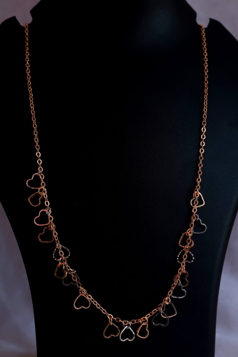 Rose Gold Tone Chain Necklace with Scattered Open Heart Charms - Image 2