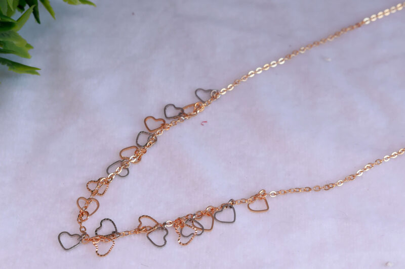 Rose Gold Tone Chain Necklace with Scattered Open Heart Charms