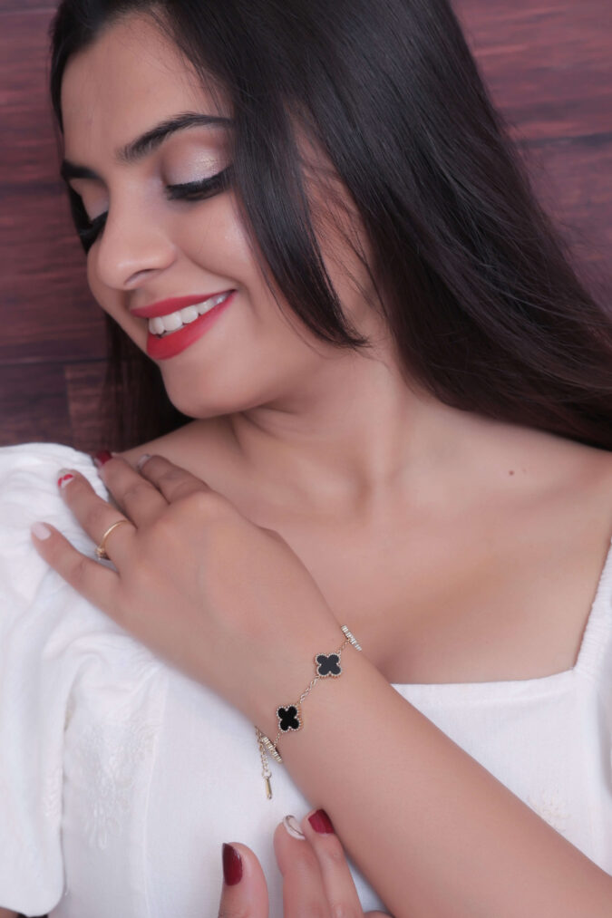 Woman showcasing a Clover Motif Bracelet