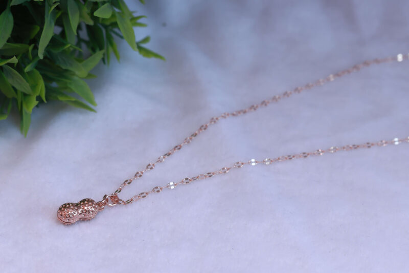Rose Gold Tone Peanut-Shaped Pendant Necklace with Pearl Accent - Image 2