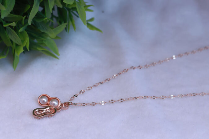 Rose Gold Tone Peanut-Shaped Pendant Necklace with Pearl Accent