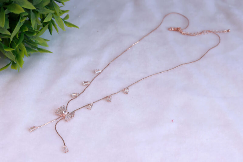 Rose Gold Tone Necklace with Sparkling Bow and Dangle Accents
